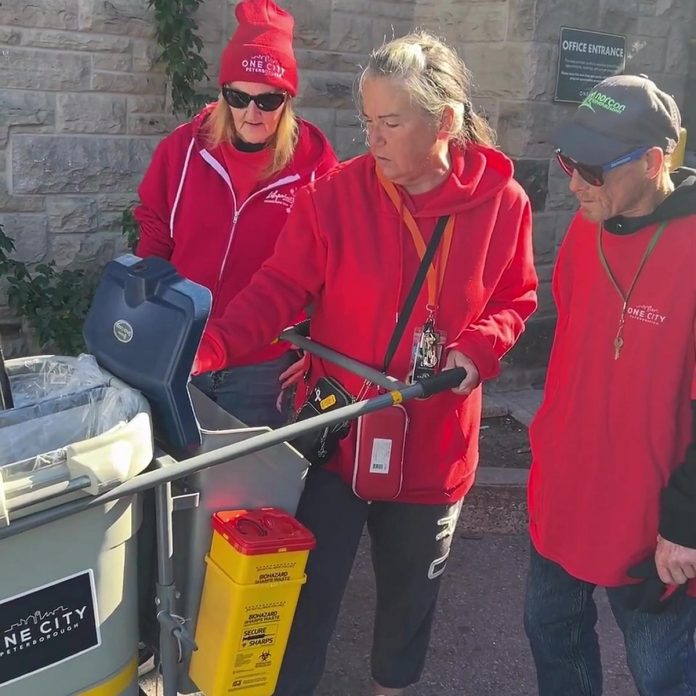 To help address cleanliness issues raised by homeowners and businesses neighbouring the Trinity Community Hub, One City Peterborough has been funded by the City of Peterborough for an eight-week pilot project to clean up garbage in downtown Peterborough. The "Clean Team" also provides opportunities for 10 people who face barriers to traditional employment. (kawarthaNOW screenshot of One City Peterborough video)