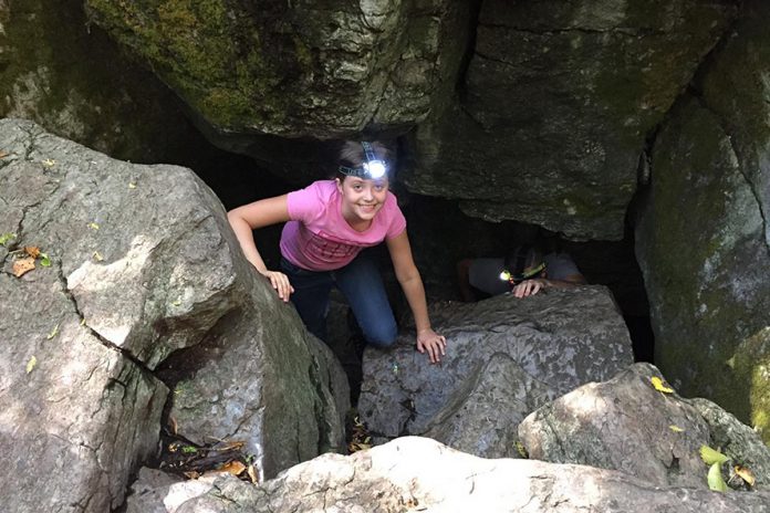 When camping at one of the unserviced campsites at Warsaw Caves Conservation Area in the Township of Douro-Dummer, visitors can explore the seven limestone caves created thousands of years ago during the last Ice Age. Above ground, the conservation area also has 15 kilometres of trails through forests and limestone plains with views of the Indian River valley from the scenic lookout. (Photo courtesy of Peterborough County Tourism)