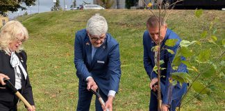 Peterborough County warden Bonnie Clark, Ukraine's ambassador to Canada Andrii Plakhotniuk, and Drohobych mayor Taras Kuchma plant a commemorative white birch representing friendship and cooperation outside the Peterborough County Courthouse on October 14, 2026 following the signing of a twinning agreement between Peterborough County and the western Ukraine municipality, which includes the cities of Drohobych and Stebnyk along with 32 villages. (Photo: Peterborough County)