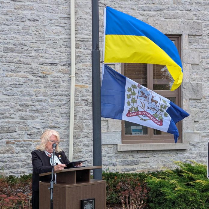 Peterborough County warden Bonnie Clark speaks during the raising of the Ukrainian flag outside the Peterborough County Courthouse on October 14, 2026 following the signing of a twinning agreement between Peterborough County and the western Ukraine municipality of Drohobych, which includes the cities of Drohobych and Stebnyk along with 32 villages. (Photo: Peterborough County)