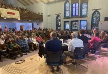 Peterborough's seven mayoral candidates attended a community discussion at New Canadians Centre on October 7, 2026, with around 250 people in the audience and another 200 online. (Photo: Paul Rellinger / kawarthaNOW)