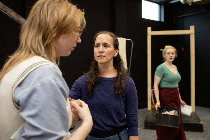 Actors Emily Kelly, Laura Lawson, and Rebecca Birrell during a rehearsal of Vern Thiessen's drama "Bluebirds," which runs at the Peterborough Theatre Guild for 10 performances from October 30 to November 14, 2026. The three women portray Canadian military nurses caring for wounded Canadian soldiers in 1918 France. (Photo: Jordan Lyall)