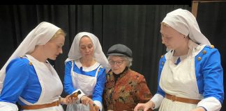 Pictured with director Bea Quarrie, Rebecca Birrell (left), Laura Lawson, and Emily Kelly perform as Canadian military nurses Bab, Maggie, and Christy in the Peterborough Theatre Guild's production of Vern Thiessen's drama "Bluebirds," which runs for 10 performances from October 30 to November 14, 2026. The play follows the three women as they care for wounded Canadian soldiers in 1918 France, gradually developing a friendship as they strive to stay hopeful while the dangers of the front draw closer to their hospital. (Photo: Paul Rellinger / kawarthaNOW)