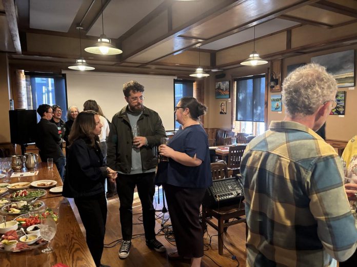 Donors, supporters, and volunteers mingle during a preview and donor appreciation event hosted by the ReFrame Film Festival at Ashburnham Ale House in Peterborough on October 18, 2026. (Photo: Megan Gallant / kawarthaNOW)
