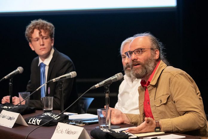 Peterborough mayoral candidate Rob Hailman speaks at ArtsVote Peterborough 2026, hosted by the Electric City Culture Council (EC3) on Wednesday, September 23 at Market Hall Performing Arts Centre in downtown Peterborough. Also pictured are fellow mayoral candidates Jacob Méthot (left) and Brian Lumsden. (Photo: Jordan Lyall / kawarthaNOW)