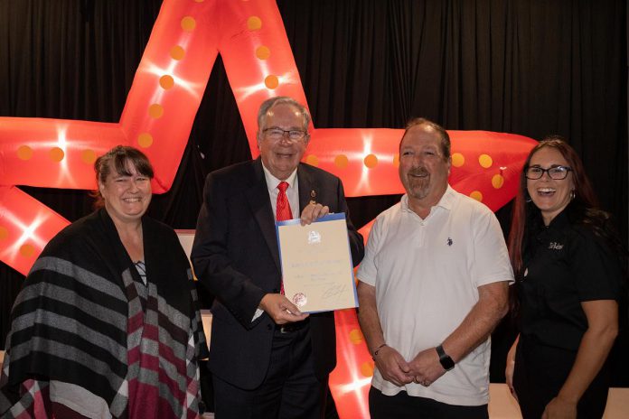 Peterborough mayor Jeff Leal presents a certificate of recognition of five years of family ownership from the City of Peterborough to The Venue owners April Sendel (left) and Kevin Sendel (second from right) and general manager Tiffany Daskewich (right) during a celebration at the downtown Peterborough event space on October 13, 2026. (Photo: Joshua Gillis) Peterborough mayor Jeff Leal presents a certificate of recognition of five years of family ownership from the City of Peterborough to The Venue owners April Sendel (left) and Kevin Sendel (second from right) and general manager Tiffany Daskewich (right) during a celebration at the downtown Peterborough event space on October 13, 2026. (Photo: Joshua Gillis)